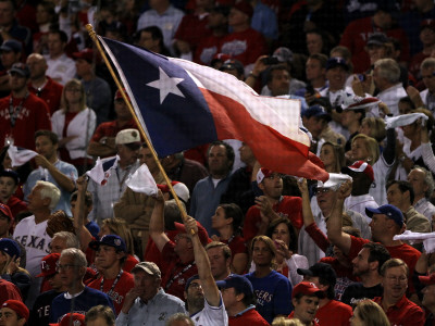 Texas Rangers V. San Francisco Giants, Game 5:  A Fan Waves A Texas State Flag by Doug Pensinger Pricing Limited Edition Print image