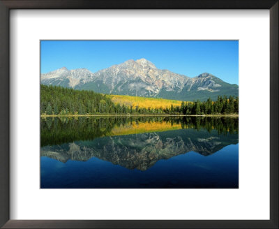Trees And Mountains Reflected In A Still Lake by Raymond Gehman Pricing Limited Edition Print image