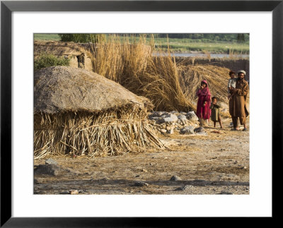 Man With Children Outside Their House, Village Near Jalalabad, Afghanistan by Jane Sweeney Pricing Limited Edition Print image