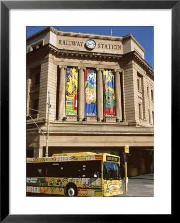 Bus Passing The Railway Station, Adelaide, South Australia, Australia by Neale Clarke Pricing Limited Edition Print image