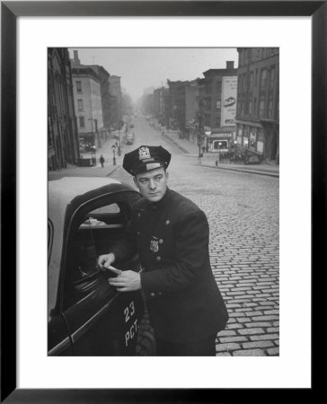 Ny Patrolman James Murphy Standing By His 23 Precinct Squad Car On Street Of His East Harlem Beat by Tony Linck Pricing Limited Edition Print image