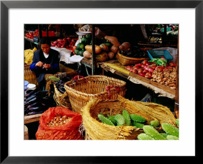 Trader At Market Stall In Old Town, Lijiang, Yunnan, China by Richard I'anson Pricing Limited Edition Print image