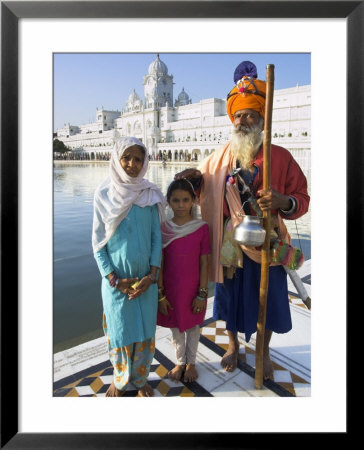 Elderly Couple Of Sikh Pilgrims With Young Girl Posing In Front Of Holy Pool, Amritsar, India by Eitan Simanor Pricing Limited Edition Print image