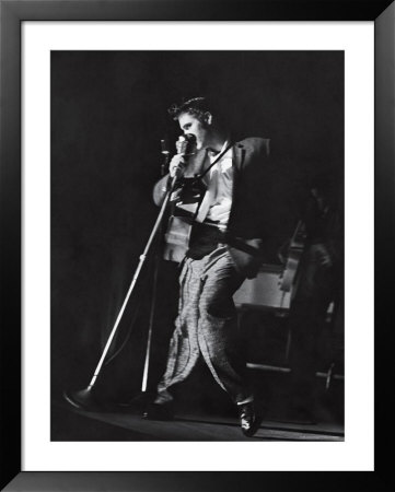 Rock Elvis Presley Doing A Bump And Grind While Singing One Of His Hits On Stage During Concert by Robert W. Kelley Pricing Limited Edition Print image
