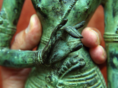 Fingers Holding The Waist Of A Bronze Shiva Statue by Images Monsoon Pricing Limited Edition Print image