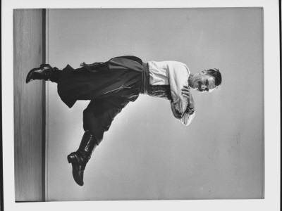 Director Of New York Community Folk Dance Center Michael Herman Demonstrating Ukrainian Dance Step by Gjon Mili Pricing Limited Edition Print image