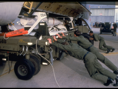 Team Straining To Push Launcher In B-52 Bomb Bay, 1985 Sac Weapons Load Competition, Ellsworth Afb by Bob Simons Pricing Limited Edition Print image