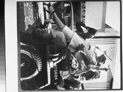 Soldier Kissing A Flag-Waving Woman On Military Jeep At Celebration Of End Of Wwii by Walter Sanders Pricing Limited Edition Print image