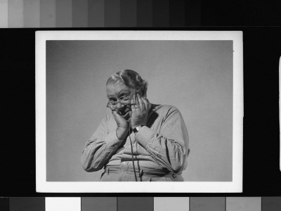 Actor S. Z. Sakall Cuddles Holding Shutter Release As He Takes His Own Photograph by Gjon Mili Pricing Limited Edition Print image