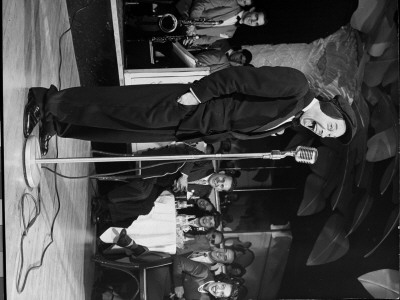 Comedian Joe E. Lewis On Stage At Copacabana Nightclub by Gjon Mili Pricing Limited Edition Print image