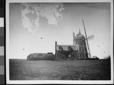 A Windmill Cottage In The Middle Of A Field by Wallace G. Levison Pricing Limited Edition Print image