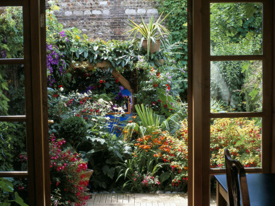 Small Town Garden: View Through French Windows To Small Courtyard Garden by Clive Nichols Pricing Limited Edition Print image