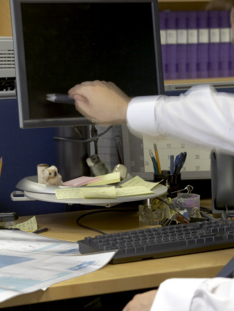 Office Life And Interiors Part Two, Employee Pointing At Computer Screen by Richard Bryant Pricing Limited Edition Print image