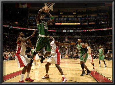 Boston Celtics V Toronto Raptors: Kevin Garnett And Amir Johnson by Ron Turenne Pricing Limited Edition Print image