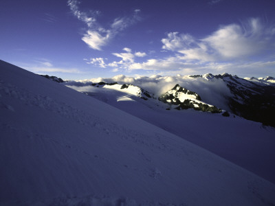 Sun Shines On Snowy Mountain Rocks, New Zealand by Michael Brown Pricing Limited Edition Print image