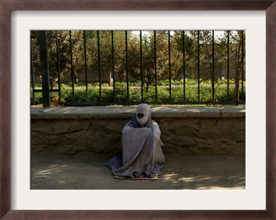 An Afghan Beggar Woman Clad In Burqa Waits To Receive Money In Kabul, Afghanistan, August 3, 2006 by Musadeq Sadeq Pricing Limited Edition Print image