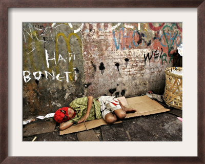 An Indonesian Boy Wearing A Spiderman Mask Sleeps On A Piece Of Cardboard by Ed Wray Pricing Limited Edition Print image