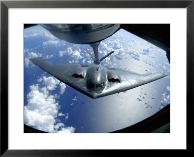 A B-2 Spirit Moves Into Position For Refueling From A Kc-135 Stratotanker Over The Pacific Ocean by Stocktrek Images Pricing Limited Edition Print image