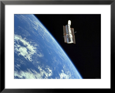 The Hubble Space Telescope With A Blue Earth In The Background by Stocktrek Images Pricing Limited Edition Print image