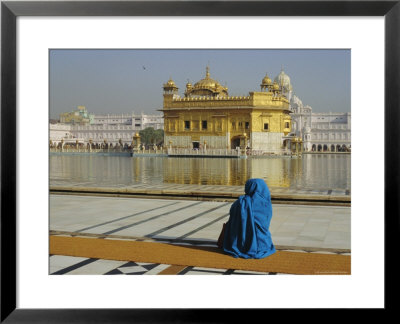 A Pilgrim In Blue Sits By The Holy Pool Of Nectar At The Golden Temple, Punjab, India by Jeremy Bright Pricing Limited Edition Print image