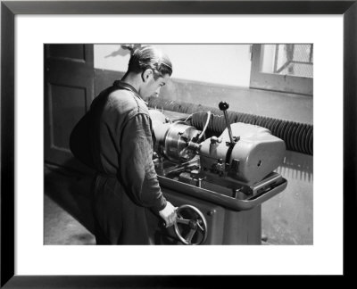 Worker At Work In The S.A.M.P. Mechanical Factory In Bologna, Producer Of Precision Mechanisms by A. Villani Pricing Limited Edition Print image
