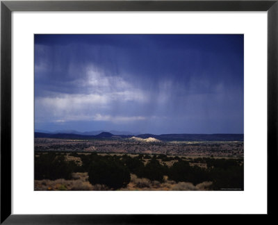 Rain Pores Down On The Desert Landscape In New Mexico by Stacy Gold Pricing Limited Edition Print image