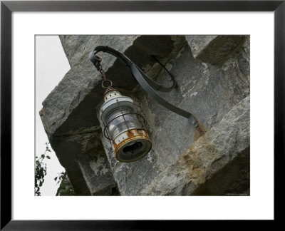 Lantern Hanging From The Wall Of An Old Lighthouse, Stonington, Connecticut by Todd Gipstein Pricing Limited Edition Print image
