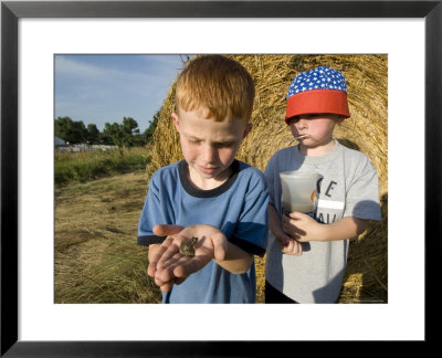 Two Young Kids Look At A Plains Leopard Frog, Greenleaf, Kansas by Joel Sartore Pricing Limited Edition Print image