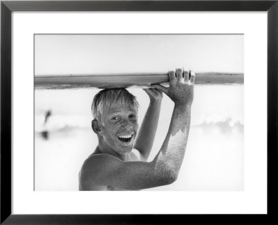 Freckled Surfer Larry Shaw Carrying Surfboard On His Head by Allan Grant Pricing Limited Edition Print image