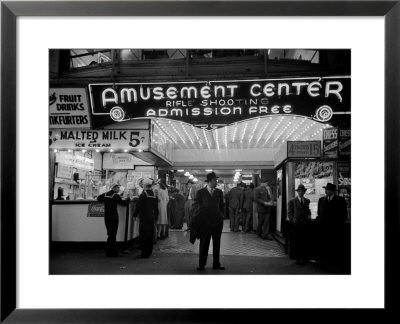 Sailors And Civilians Outside A Brightly Lit Times Square Arcade During Wwii by Peter Stackpole Pricing Limited Edition Print image