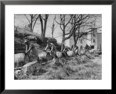 Barrels Being Rolled On Wooden Rails At Jack Daniels Distillery by Ed Clark Pricing Limited Edition Print image