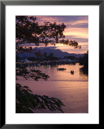 Sunset Over Passenger Sampans On Sarawak River by John Borthwick Pricing Limited Edition Print image