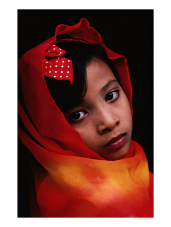 A Portrait Of A Muslim Girl With Her Face Framed By A Colourful Scarf, Indonesia by Gregory Adams Pricing Limited Edition Print image
