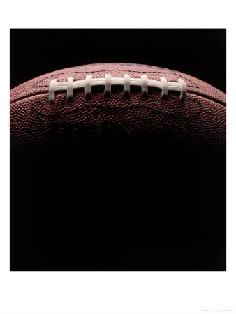 Close-Up Of Football Against Black Background by Rick Kooker Pricing Limited Edition Print image
