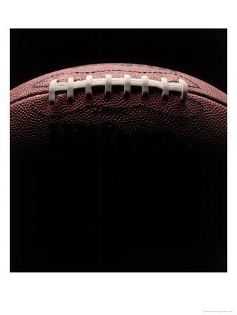 Close-Up Of Football Against Black Background by Rick Kooker Pricing Limited Edition Print image