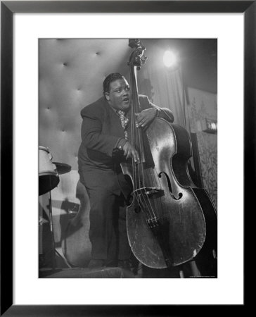 Jazzman Playing A Bass In A Club by Peter Stackpole Pricing Limited Edition Print image