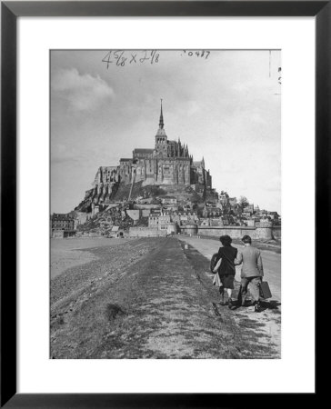 Couple Walking On Causeway Toward Mont Saint Michel by Ralph Morse Pricing Limited Edition Print image