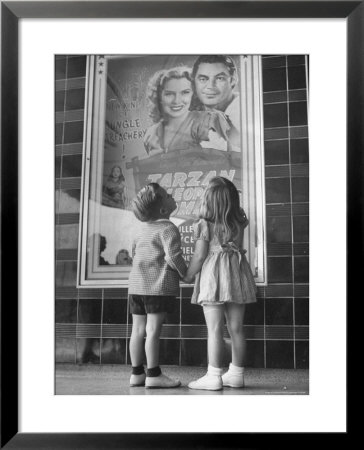 Children Looking At Posters Outside Movie Theater by Charles E. Steinheimer Pricing Limited Edition Print image