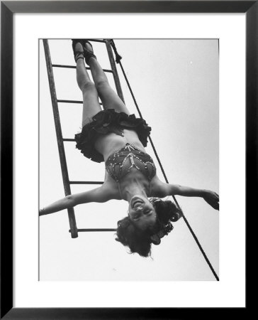 Circus Performer Hanging Upside Down by Cornell Capa Pricing Limited Edition Print image