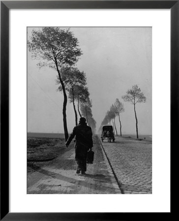 Displaced Person Returning Home From German Prison Camp, Walking Down Country Road by Ralph Morse Pricing Limited Edition Print image