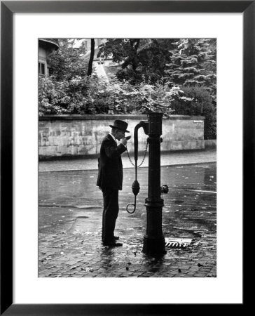 Man Drinking Water At Well Pump by Alfred Eisenstaedt Pricing Limited Edition Print image