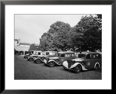 Red Cross Ambulances Parked Inside The Petronio Vecchio Depot, In Bologna, During World War Ii by A. Villani Pricing Limited Edition Print image