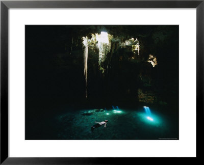 Man Swimming In The Sunlit Cenote by Stephen Alvarez Pricing Limited Edition Print image