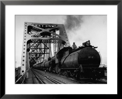 Long String Of Tank Cars Rumbling Across The 4 1/2 Mile Huey Long Bridge At New Orleans by Peter Stackpole Pricing Limited Edition Print image