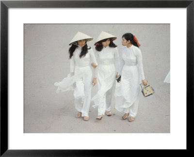 Three Vietnamese Young Women In White Fashion Walking Down The Street by Co Rentmeester Pricing Limited Edition Print image