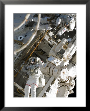Astronauts Participating In Extravehicular Activity During Sts-124 by Stocktrek Images Pricing Limited Edition Print image