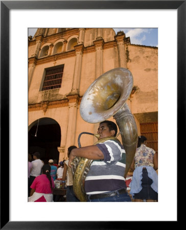 Tuba Player In Front Of Iglesia San Juan Bautista De Subtiava During Semana Santa, Leon, Nicaragua by Margie Politzer Pricing Limited Edition Print image