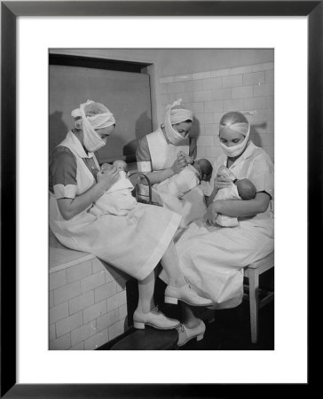 Special Nursery Nurses Wearing Masks As They Bottle-Feed Fully Developed Premature Babies by Hansel Mieth Pricing Limited Edition Print image