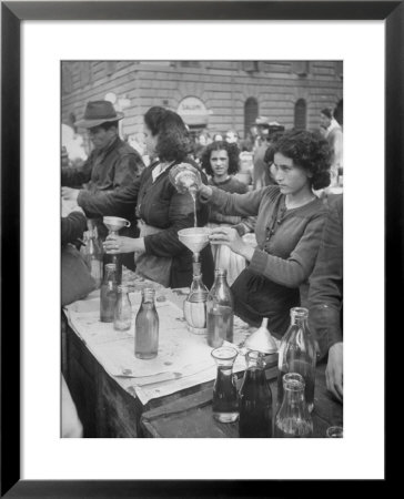 Pouring Olive Oil In Buyers' Bottles In Black Market by Alfred Eisenstaedt Pricing Limited Edition Print image