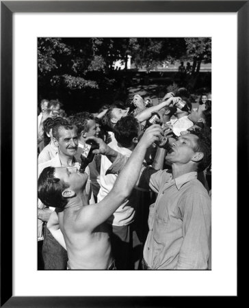 Men Having A Beer Drinking Contest At The Company Picnic by Allan Grant Pricing Limited Edition Print image